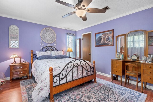16 Valley Rd, Cabot, AR 72023 - bedroom with visible vents, baseboards, ornamental molding, a ceiling fan, and wood finished floors