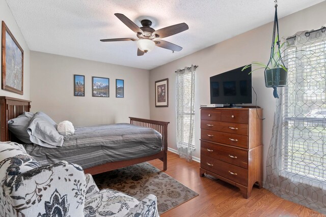 16 Valley Rd, Cabot, AR 72023 - bedroom featuring light wood-style flooring, a ceiling fan, and a textured ceiling