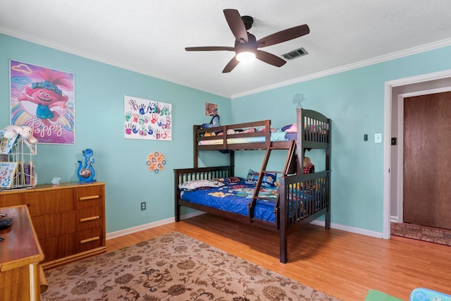 16 Valley Rd, Cabot, AR 72023 - bedroom with crown molding, visible vents, baseboards, and wood finished floors