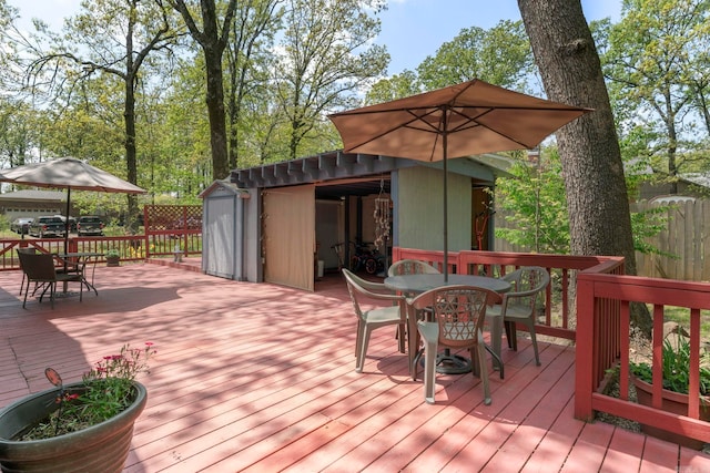 16 Valley Rd, Cabot, AR 72023 - deck featuring outdoor dining area, a storage shed, and an outdoor structure
