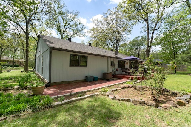 16 Valley Rd, Cabot, AR 72023 - rear view of house with a wooden deck, a shingled roof, cooling unit, and a lawn