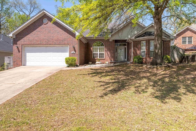 ranch-style home with brick siding, a front yard, an attached garage, and driveway