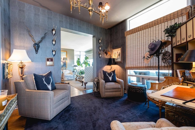 living area with a chandelier and wood finished floors