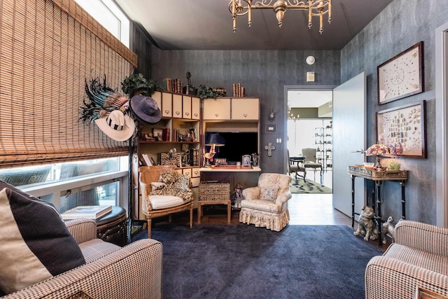 living area with an inviting chandelier