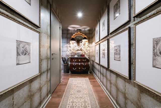 hall with recessed lighting and wood finished floors