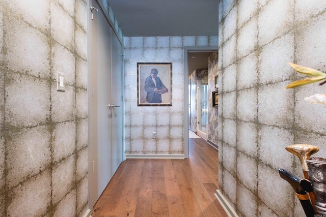 hall with wood finished floors