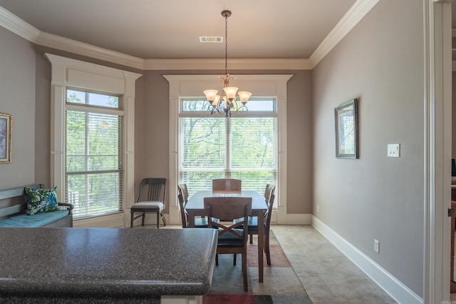 dining area with a chandelier, plenty of natural light, visible vents, and crown molding