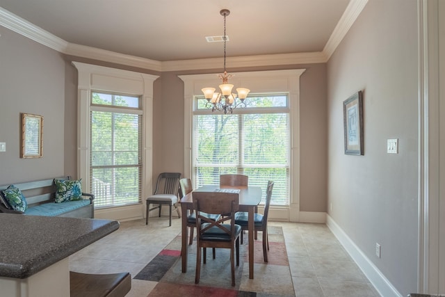 dining space featuring a healthy amount of sunlight, an inviting chandelier, and ornamental molding
