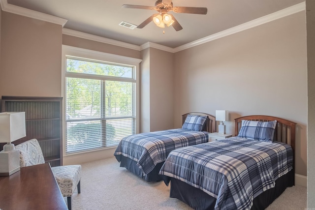 carpeted bedroom featuring ornamental molding, visible vents, and ceiling fan