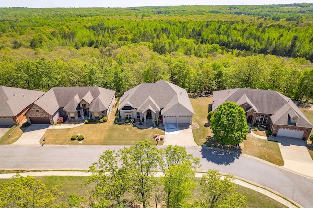 aerial view featuring a wooded view