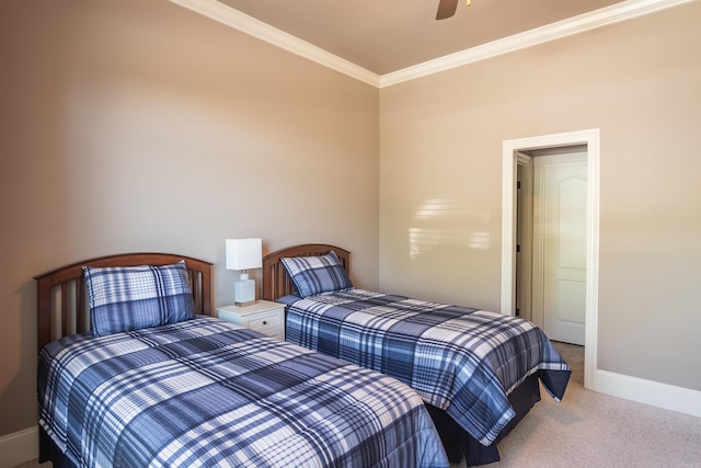 bedroom featuring carpet flooring, baseboards, ornamental molding, and ceiling fan