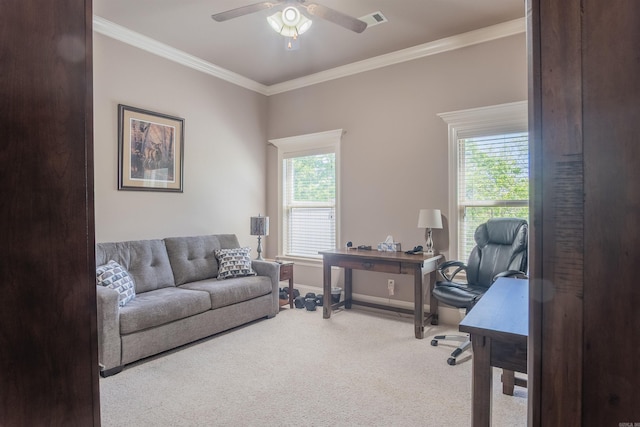 home office with baseboards, a ceiling fan, crown molding, carpet floors, and visible vents