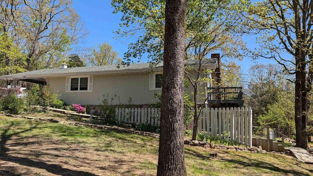 1012 Fairwater Cir, Horseshoe Bend, AR 72512 - view of property exterior featuring fence and a chimney