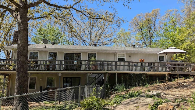 1012 Fairwater Cir, Horseshoe Bend, AR 72512 - back of property featuring a wooden deck and fence
