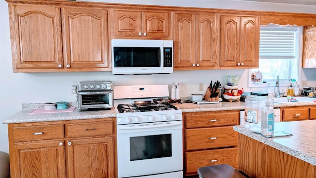 1012 Fairwater Cir, Horseshoe Bend, AR 72512 - kitchen featuring a toaster, white appliances, light countertops, and a sink