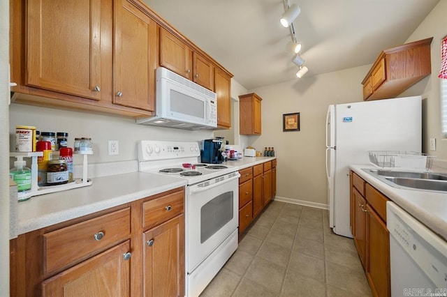 1100 Woodlawn Ave Unit K-61, Hot Springs, AR 71913 - kitchen featuring brown cabinets, light countertops, rail lighting, and white appliances