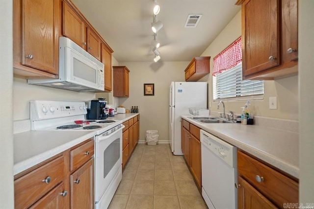1100 Woodlawn Ave Unit K-61, Hot Springs, AR 71913 - kitchen with white appliances, visible vents, light countertops, a sink, and brown cabinets