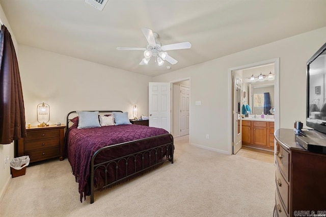 1100 Woodlawn Ave Unit K-61, Hot Springs, AR 71913 - bedroom with visible vents, baseboards, ceiling fan, ensuite bath, and light carpet