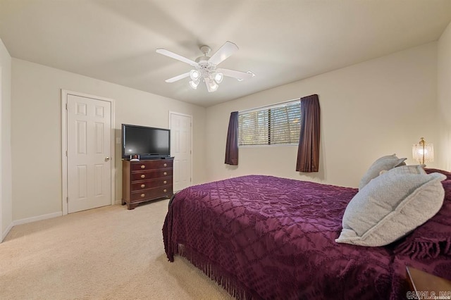 1100 Woodlawn Ave Unit K-61, Hot Springs, AR 71913 - bedroom with light colored carpet, baseboards, and ceiling fan