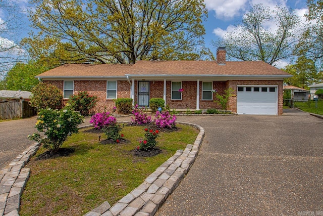 6808 Sandpiper Dr, Little Rock, AR 72205 - ranch-style home featuring a chimney, driveway, an attached garage, brick siding, and fence