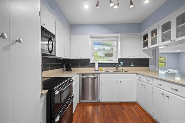 6808 Sandpiper Dr, Little Rock, AR 72205 - kitchen featuring dark wood-type flooring, a sink, black appliances, and a wealth of natural light