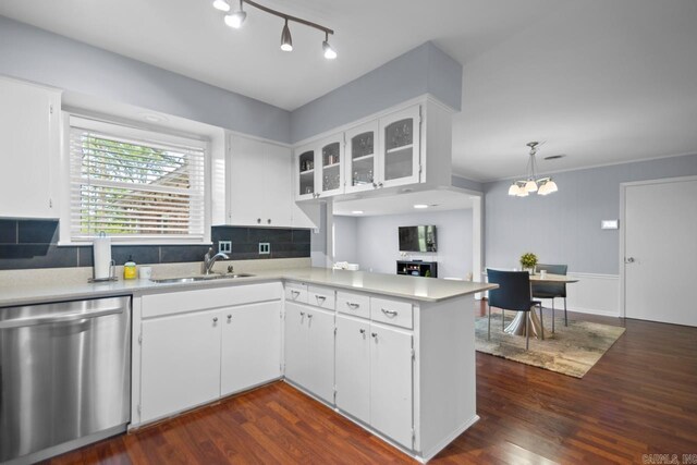 6808 Sandpiper Dr, Little Rock, AR 72205 - kitchen featuring a sink, light countertops, stainless steel dishwasher, and a peninsula