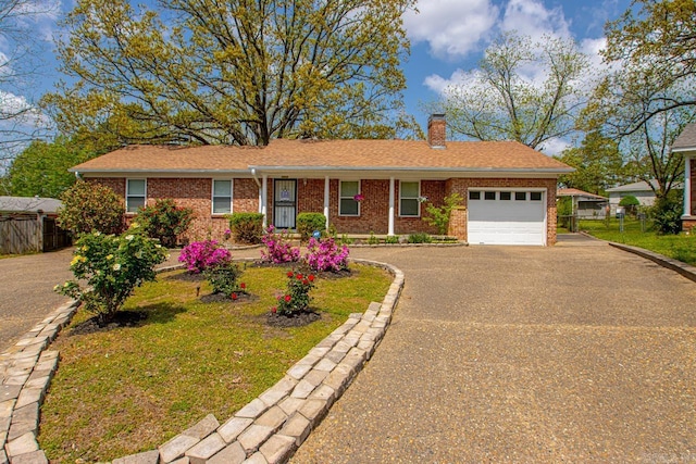 6808 Sandpiper Dr, Little Rock, AR 72205 - ranch-style house featuring brick siding, an attached garage, driveway, and a chimney