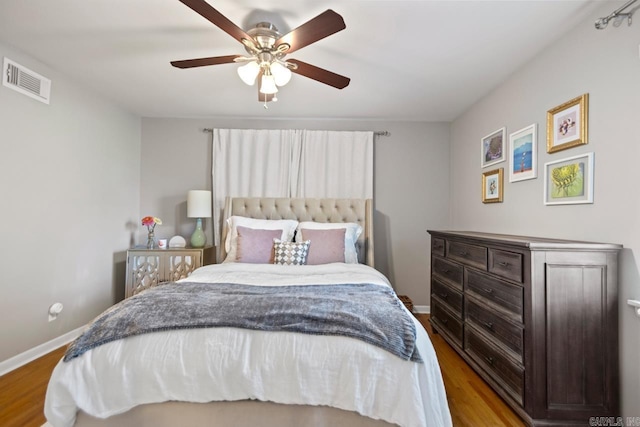 6808 Sandpiper Dr, Little Rock, AR 72205 - bedroom with visible vents, baseboards, ceiling fan, and wood finished floors