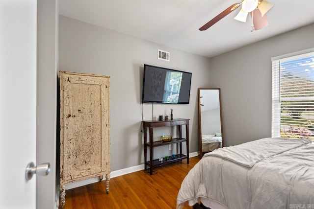 6808 Sandpiper Dr, Little Rock, AR 72205 - bedroom with wood finished floors, ceiling fan, baseboards, and visible vents