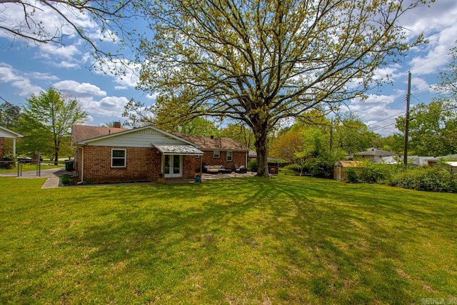 6808 Sandpiper Dr, Little Rock, AR 72205 - view of yard featuring french doors