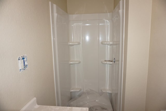 full bath featuring walk in shower