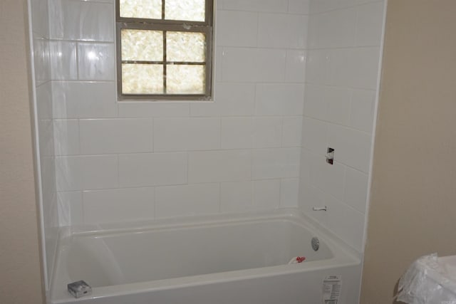 bathroom with shower / tub combination