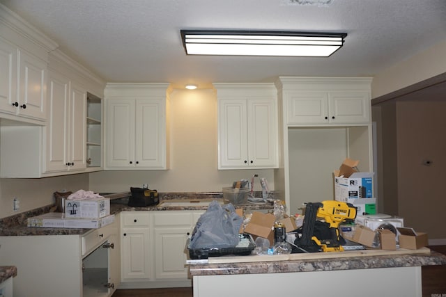 kitchen with white cabinets and a center island