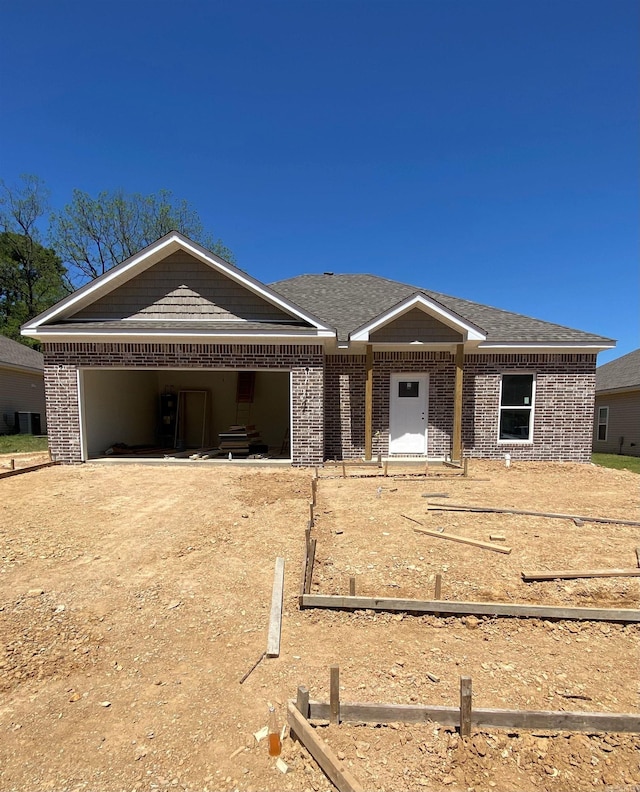 3512 Village Walk Dr, Bryant, AR 72022 - ranch-style house featuring brick siding, dirt driveway, and an attached garage