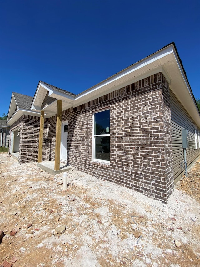 3512 Village Walk Dr, Bryant, AR 72022 - view of side of property featuring brick siding and an attached garage