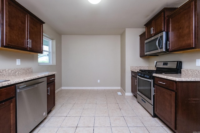6 Broadmoor Dr, Little Rock, AR 72204 - kitchen featuring baseboards, appliances with stainless steel finishes, light countertops, and dark brown cabinets