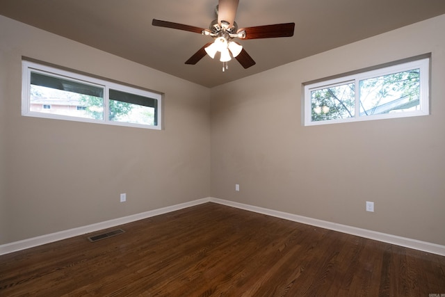 6 Broadmoor Dr, Little Rock, AR 72204 - empty room featuring a healthy amount of sunlight, dark wood-style flooring, baseboards, and visible vents