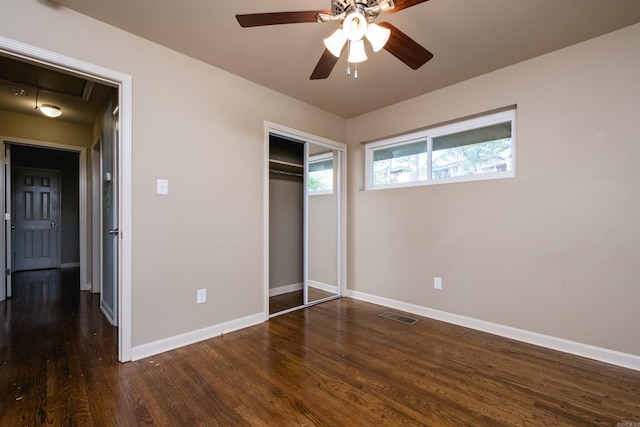 6 Broadmoor Dr, Little Rock, AR 72204 - unfurnished bedroom with ceiling fan, a closet, visible vents, dark wood-style flooring, and baseboards