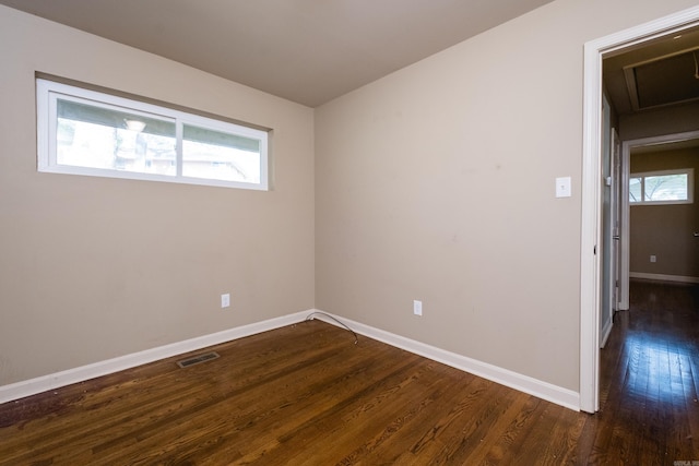6 Broadmoor Dr, Little Rock, AR 72204 - empty room with visible vents, baseboards, and dark wood-style floors