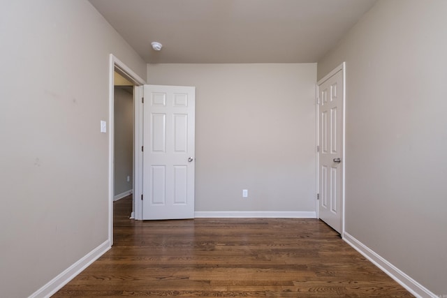 6 Broadmoor Dr, Little Rock, AR 72204 - spare room with dark wood-type flooring and baseboards