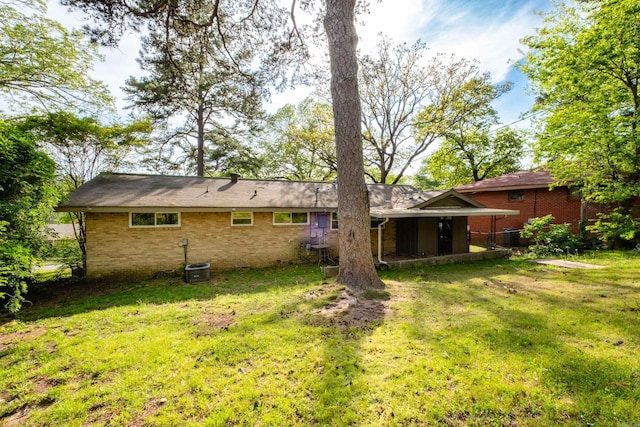 6 Broadmoor Dr, Little Rock, AR 72204 - back of house with a yard, brick siding, and cooling unit