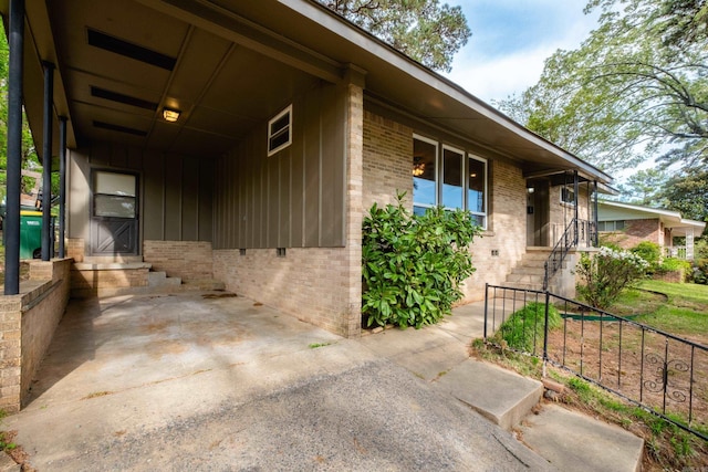 6 Broadmoor Dr, Little Rock, AR 72204 - view of side of home with an attached carport and brick siding