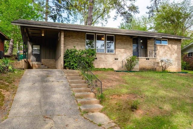 6 Broadmoor Dr, Little Rock, AR 72204 - view of front facade featuring a front yard and brick siding