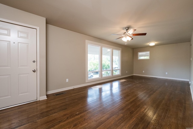 6 Broadmoor Dr, Little Rock, AR 72204 - unfurnished room featuring baseboards, visible vents, dark wood-style flooring, and a ceiling fan