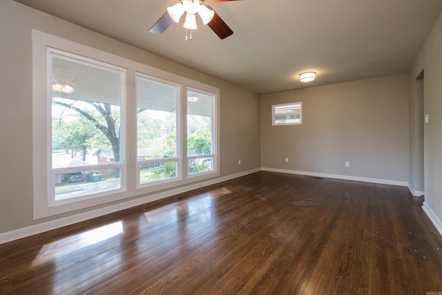 6 Broadmoor Dr, Little Rock, AR 72204 - empty room with visible vents, baseboards, ceiling fan, and dark wood finished floors