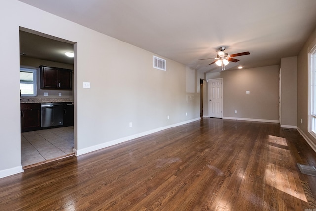 6 Broadmoor Dr, Little Rock, AR 72204 - unfurnished living room with visible vents, ceiling fan, baseboards, and dark wood-style floors