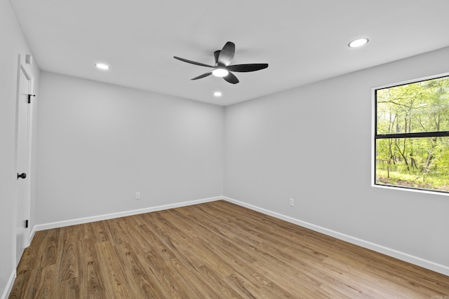 unfurnished room with recessed lighting, baseboards, wood finished floors, and ceiling fan