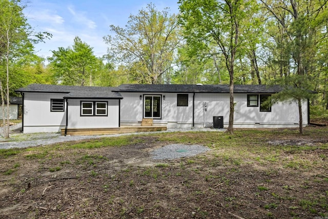 ranch-style home with roof with shingles and crawl space