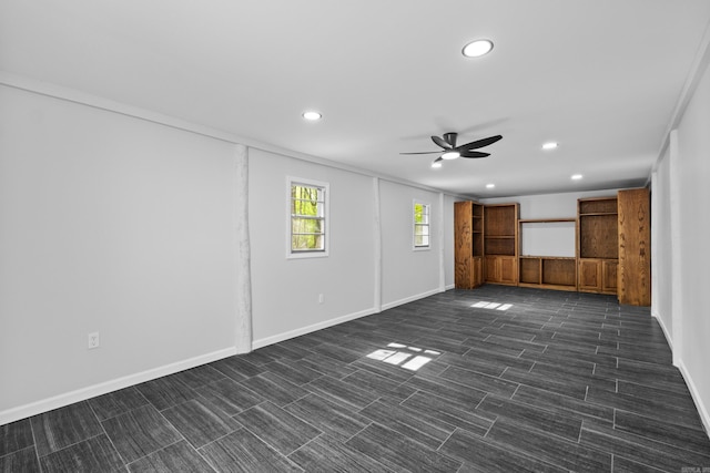 unfurnished living room featuring baseboards, a ceiling fan, and recessed lighting
