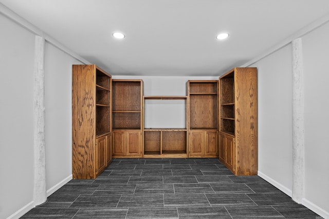 interior space featuring recessed lighting, baseboards, and wood tiled floor